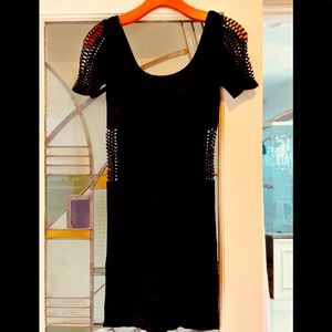 bebe Black stretch Dress.  Sleek and Sexy.  Machine washable.  Only worn once.